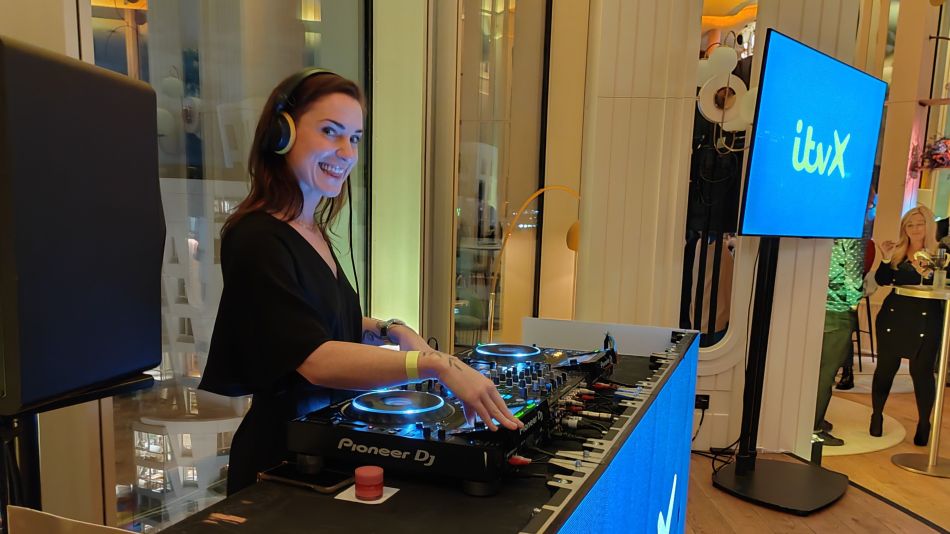 A DJ on the decks at ITVX 1st birthday party in London