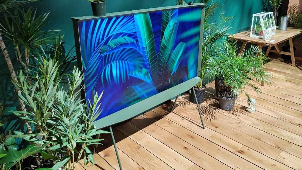 Ivy Green Samsung Serif TV surrounded by shrubs and greenery
