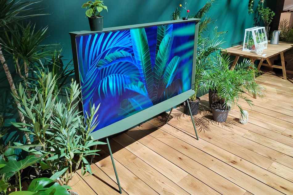 Ivy Green Samsung Serif TV surrounded by shrubs and greenery