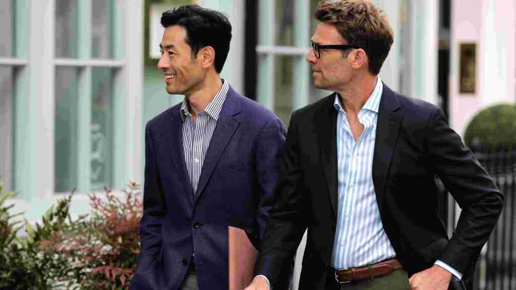Charles Tyrwhitt suits worn by two men out walking with purpose