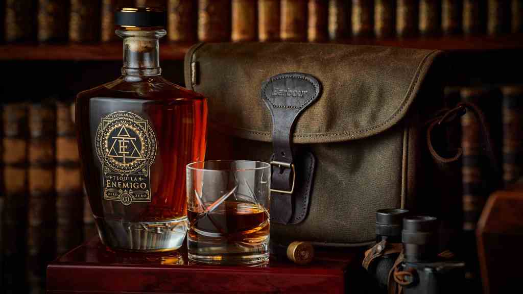 Tequila Enemigo with a stylish shoulder bag