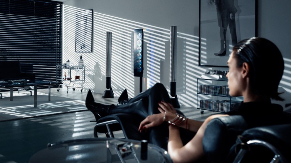 A stylish lady listens to a Bang & Olufsen Beosystem 9000c system