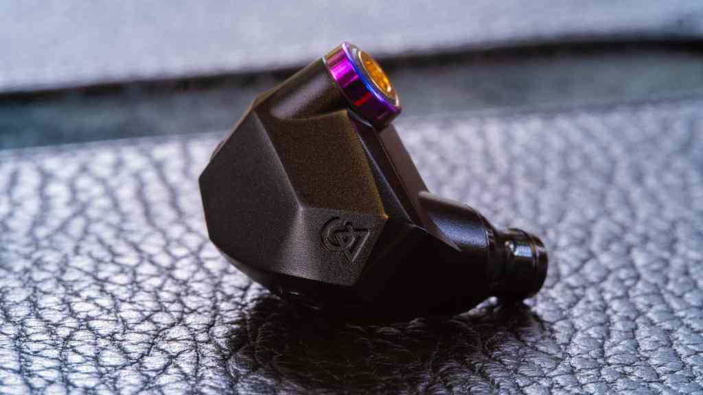 A single Campfire Audio Fathom IEM earphone on a case