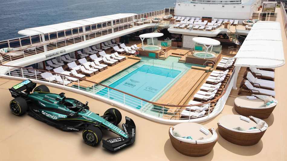 An Aston Martin F1 car parked above the pool deck on the Sewven Seas Splendor cruise ship