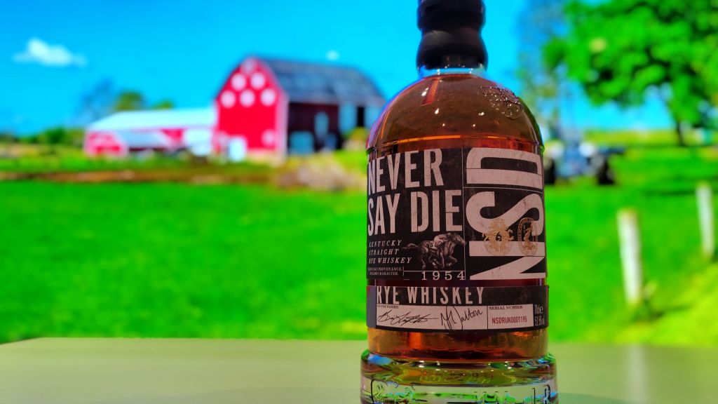 Never Say Die bourbon with farm backdrop