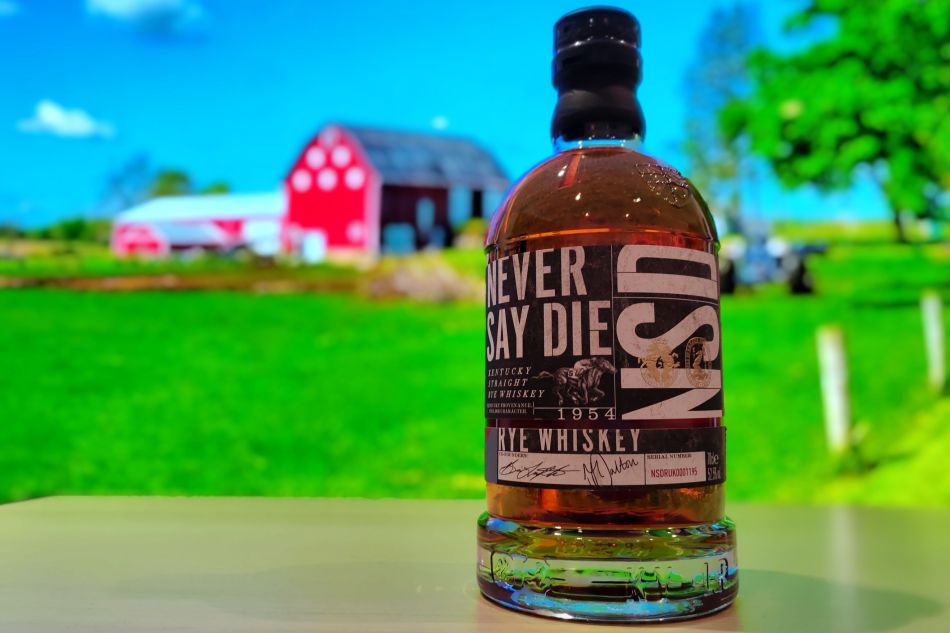 Never Say Die bourbon with farm backdrop