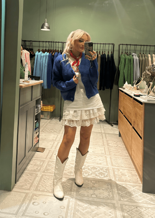 Girl wearing Ahkeke London blue cardigan