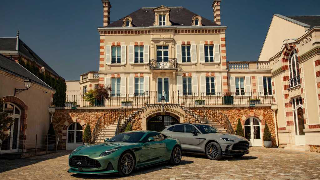 Aston Martin cars outside Champagne Bollinger