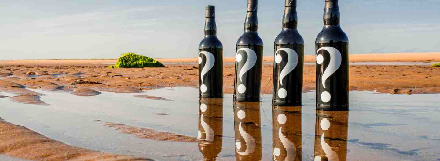 Mystery Malt series 6 whiskies on a beach