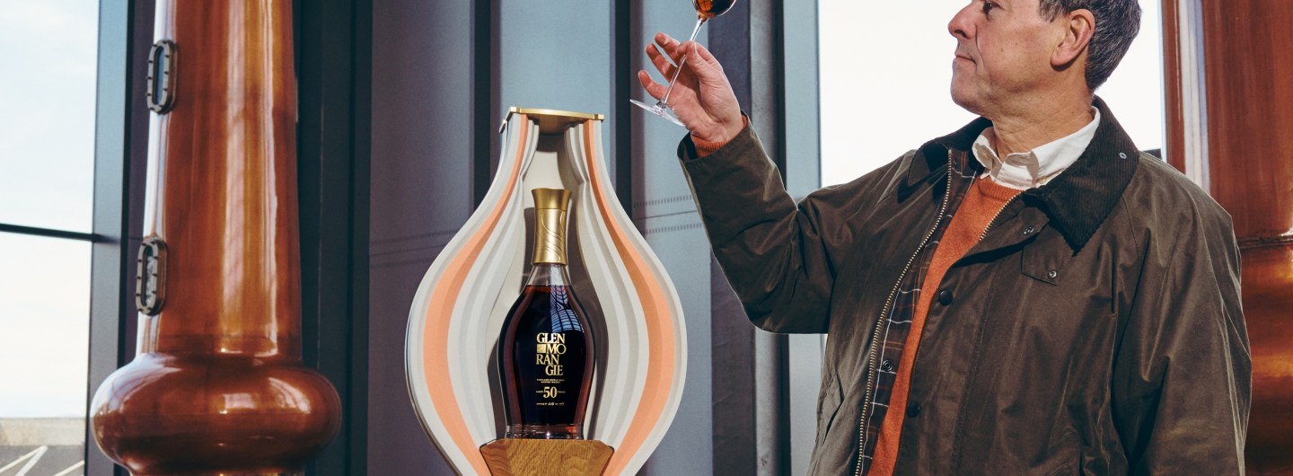 Dr Bill Lumsden holds Glenmorangie 50yo aloft