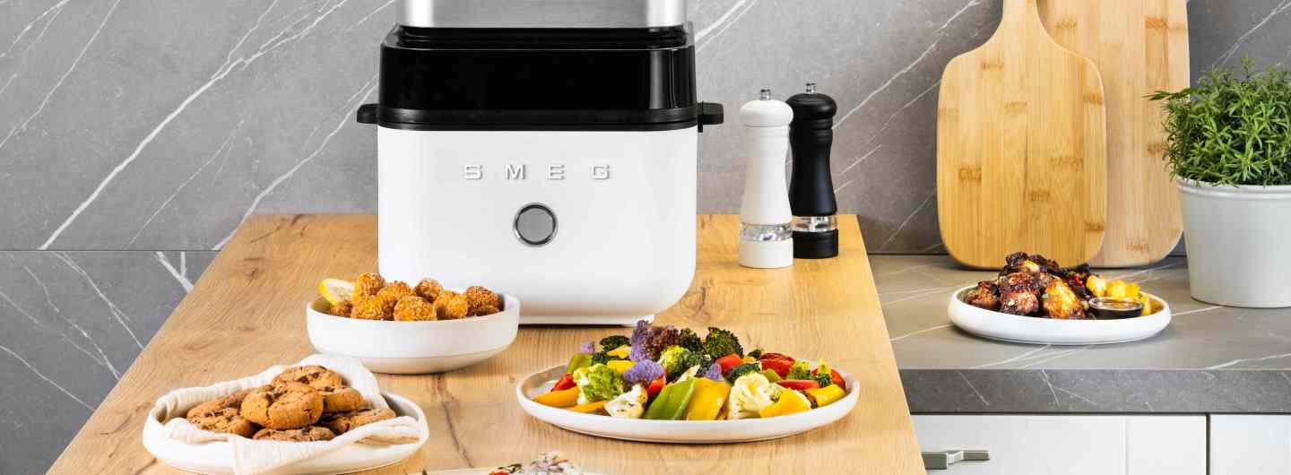 SMEG Air Fryer and plates of food