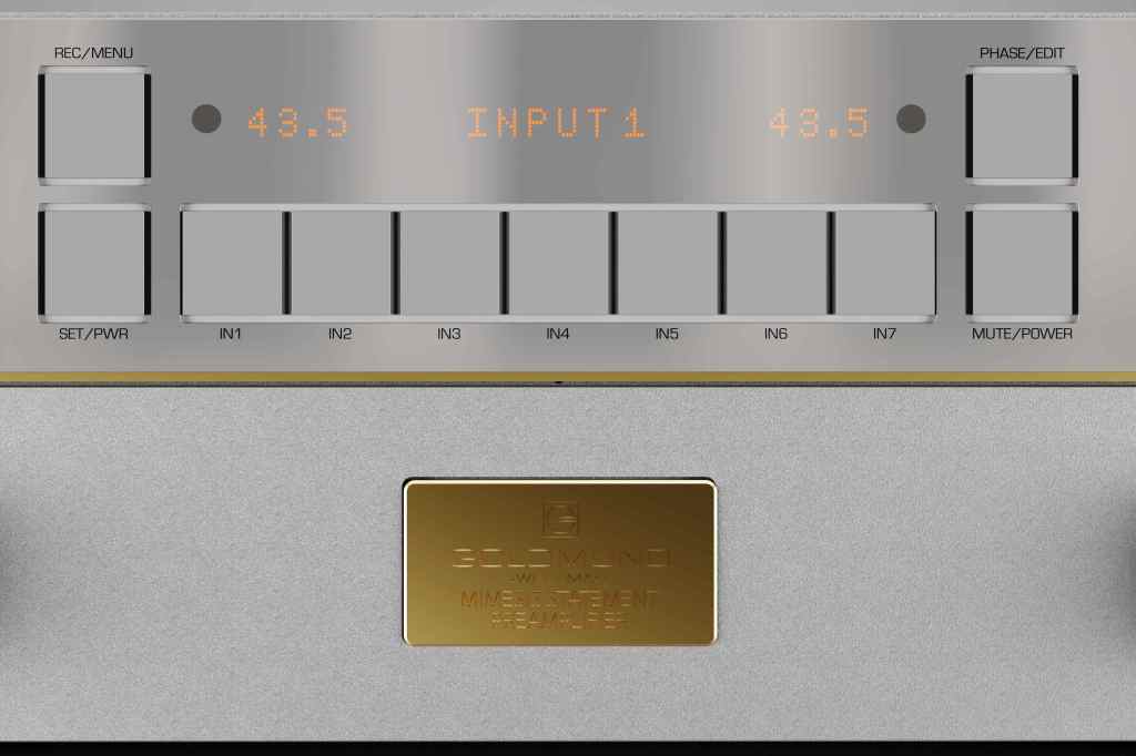 A close-up view of an audio device control panel featuring digital display options, input selectors, and buttons for menu navigation and power settings.