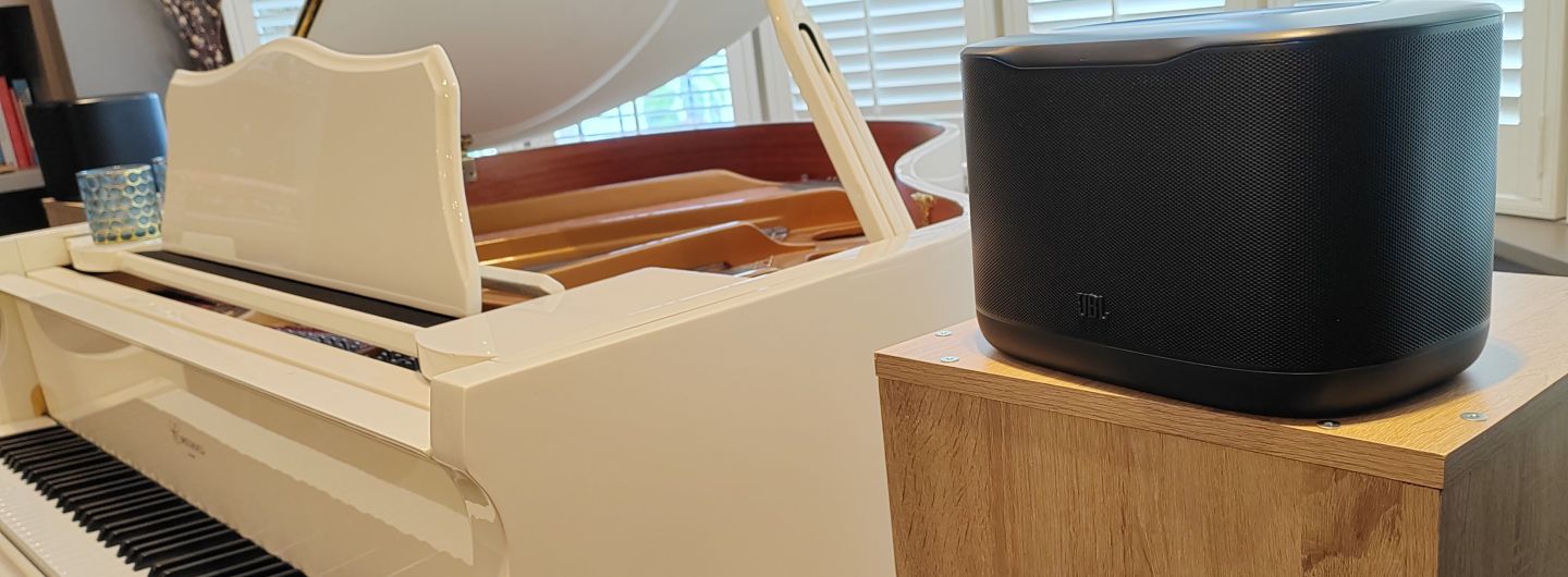 JBL Cove X1 near a grand piano