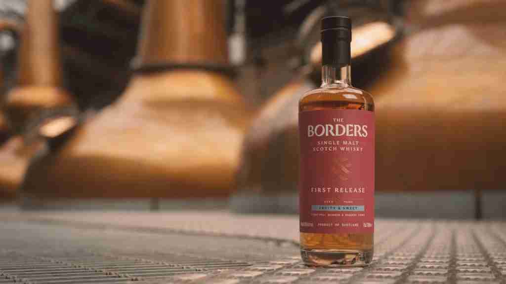 The Borders Distillery - Lifestyle Bottle in front of stills