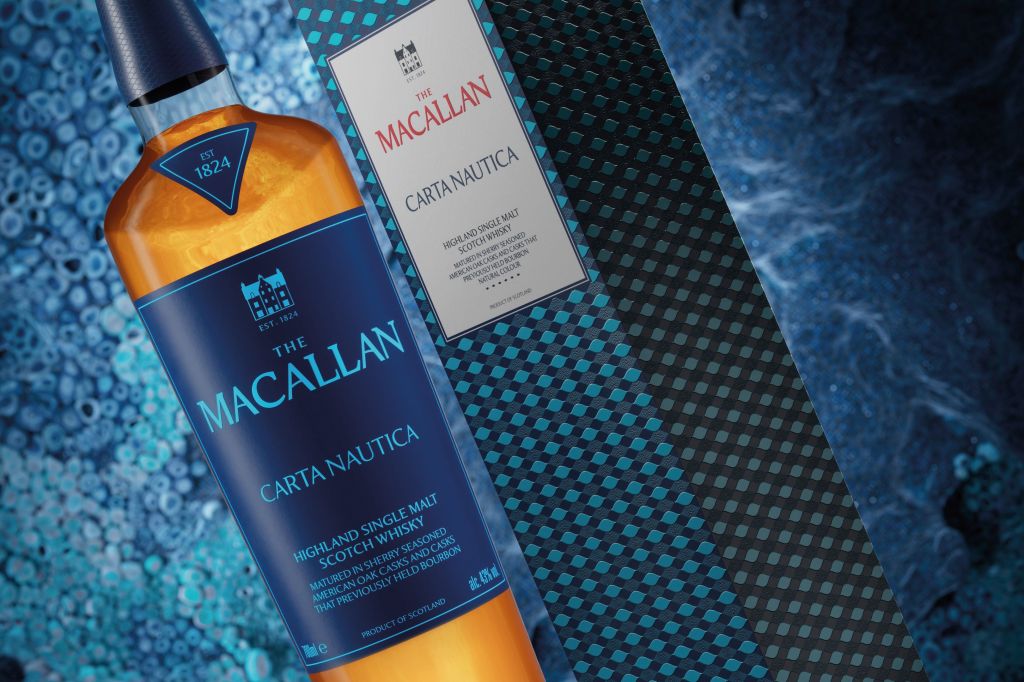 A bottle of The Macallan Carta Nautica Highland Single Malt Scotch Whisky, displayed against a textured blue background.